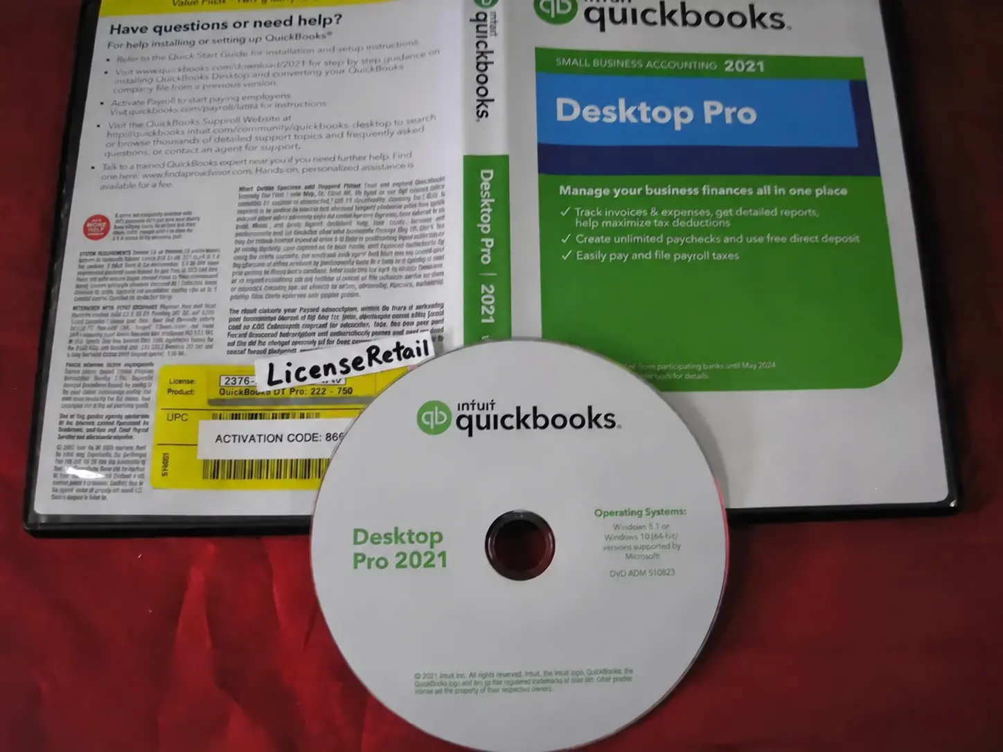 Open QuickBooks Desktop Pro 2021 retail DVD case showing the disc and the license and activation code sticker