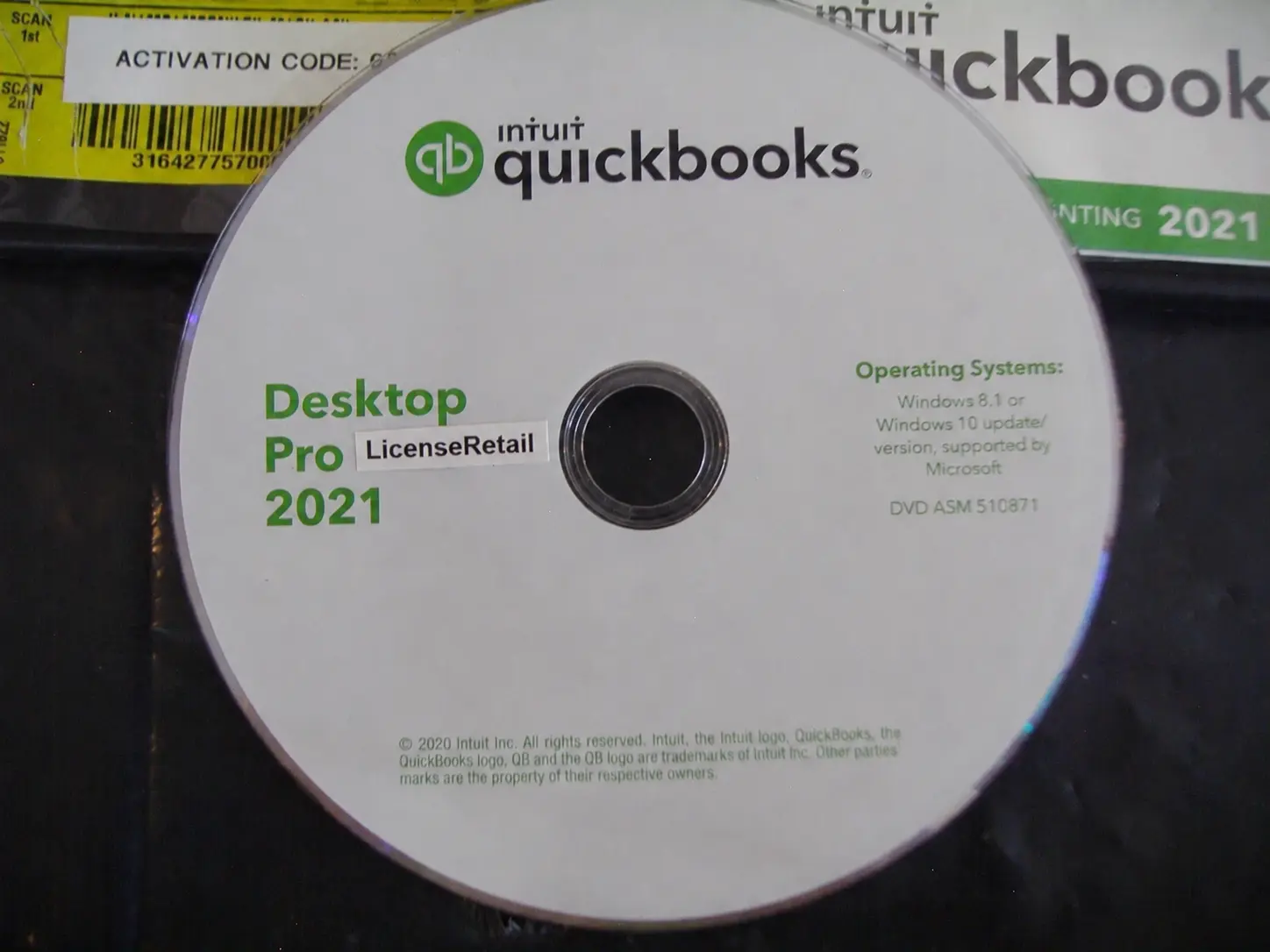 Pro2021-3 Close-up of the Intuit QuickBooks Desktop Pro 2021 DVD listing Windows 8.1 and Windows 10 64-bit